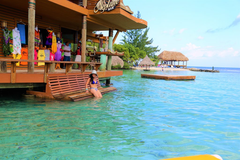 Woman sitting on a bench at Roatan Little French Key