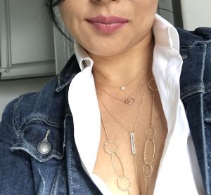 four layered gold necklaces with white shirt and jean jacket four layered gold necklaces with white shirt and jean jacket
