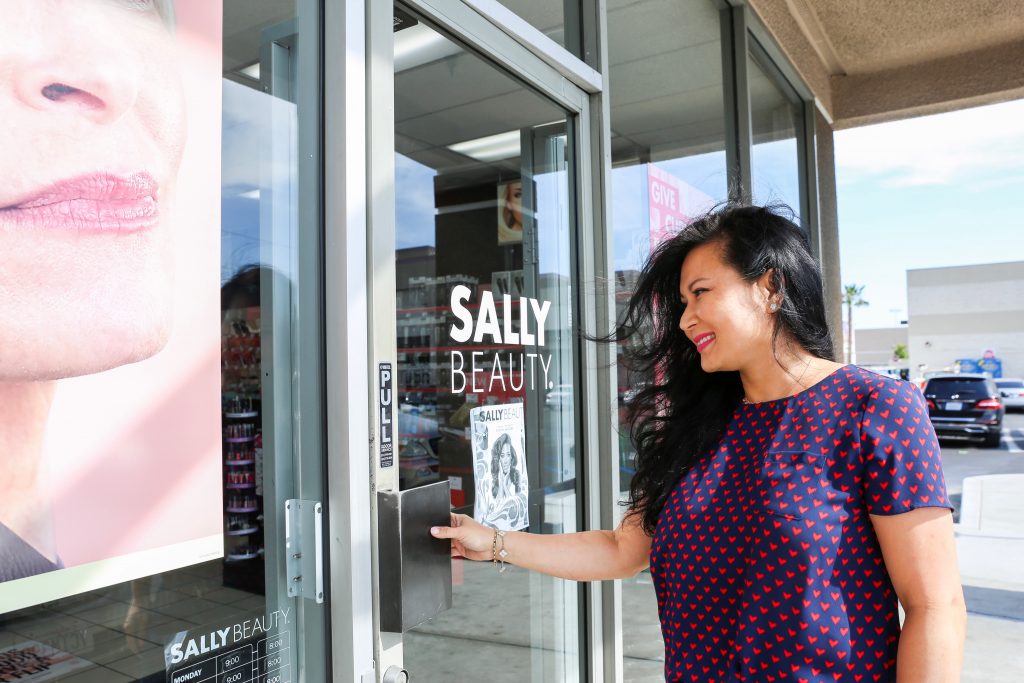 woman entering sally's beauty supply